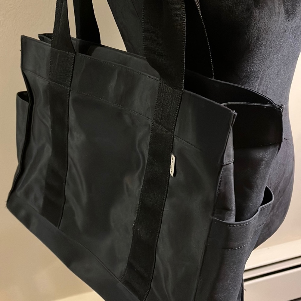 Old Navy Black nylon tote bag. Great pockets and compartments. Sturdy Strap - Picture 2 of 12